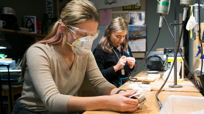 Two students at workshop bench in Metalsmith class