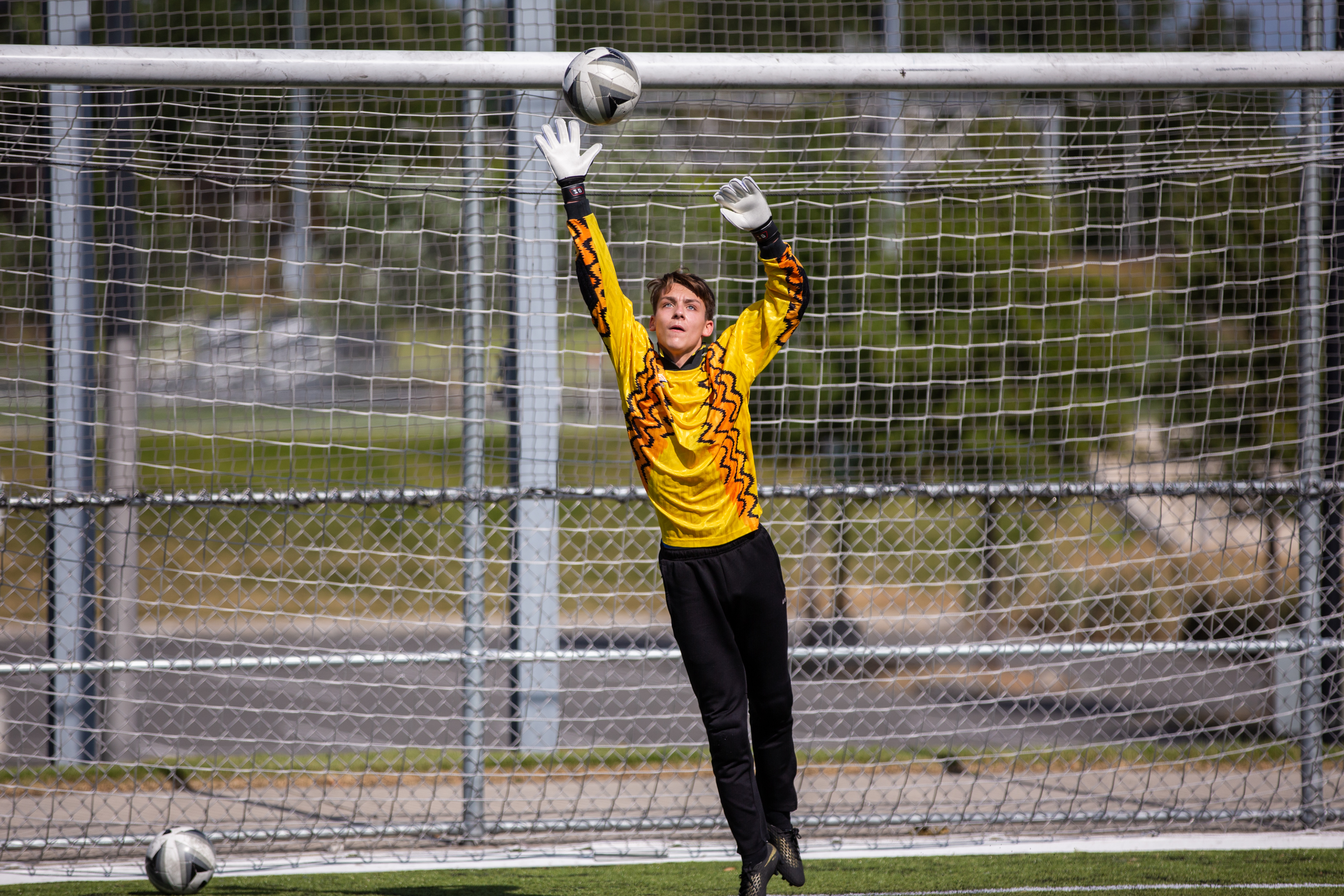 Goalie making save with fingertips