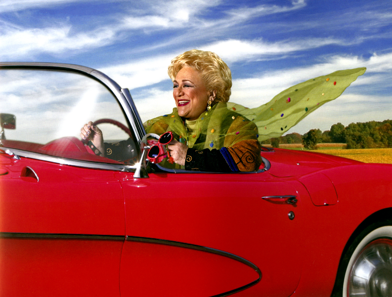 Sally Smith in red corvette