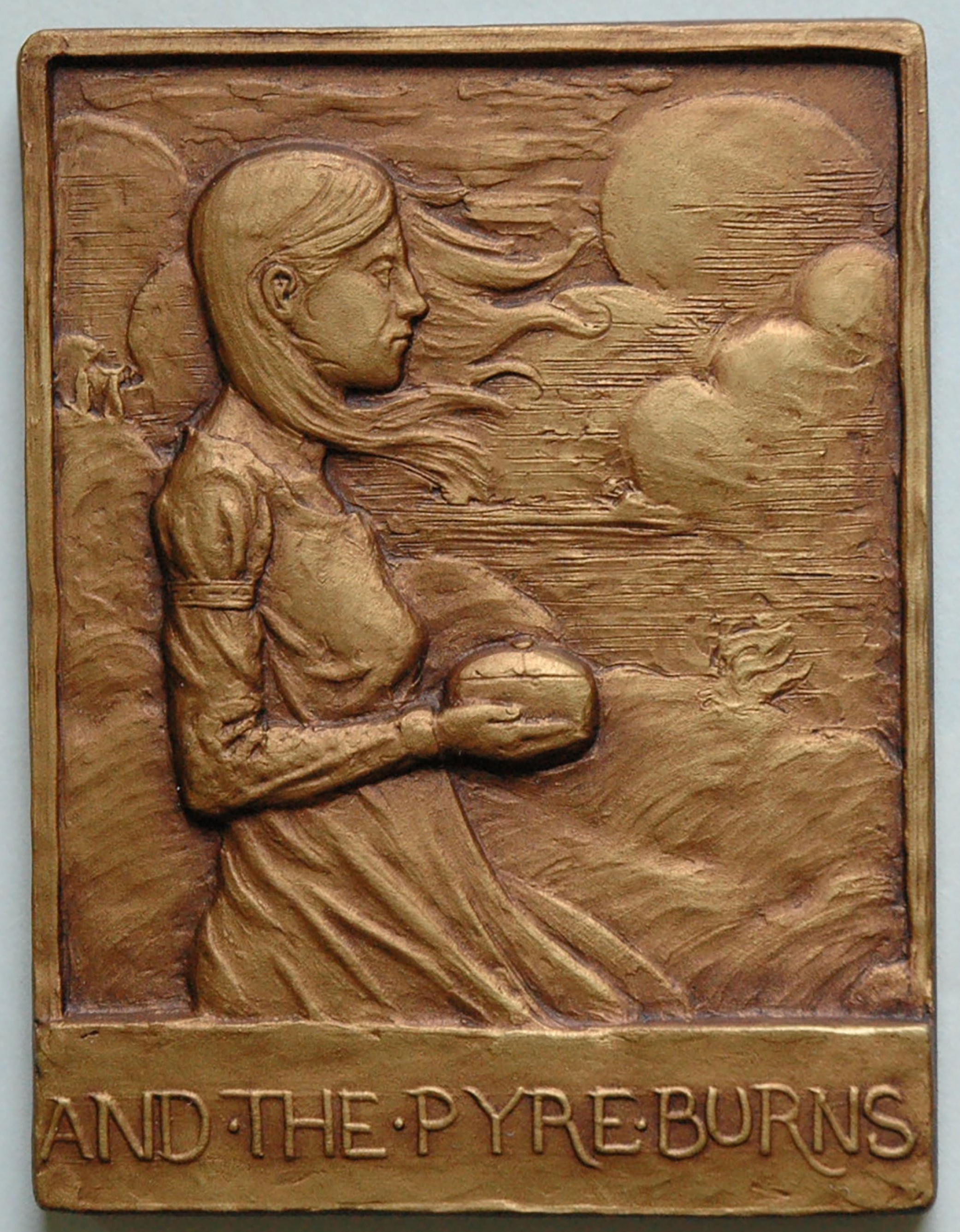 photo of a bronze relief depicting a woman in the breeze