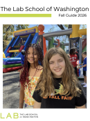 two girls on a playground smiling at the camera