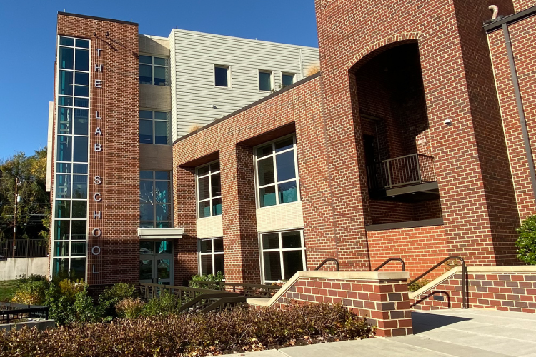 A wide-lens shot of the exterior of the high school