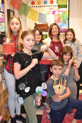 Group of students holding crafts