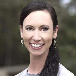 Headshot of a brunette woman smiling