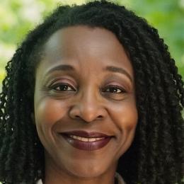 Headshot of a Black woman smiling