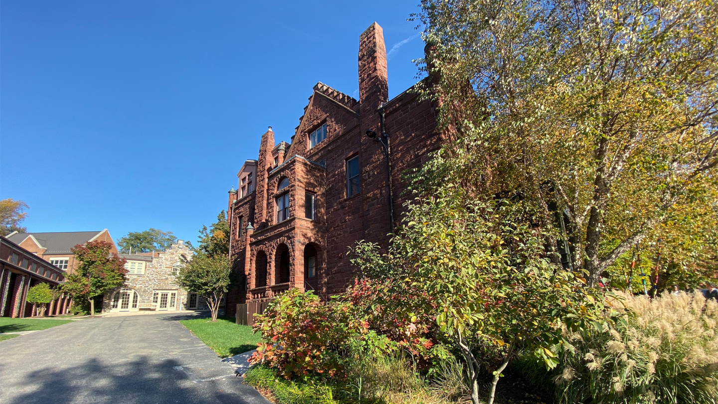 The castle soaks up the mid-fall sun while the surrounding trees change colors.