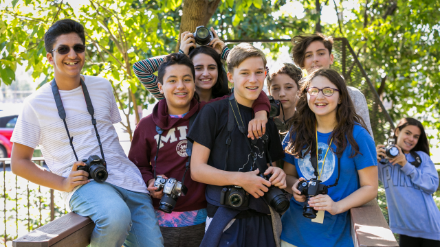 Group of photography students outside on sunny day