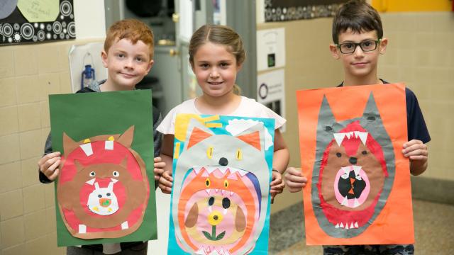 Elementary Students holding Art