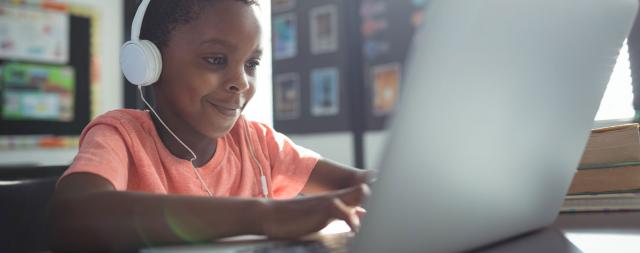 Boy learning at computer