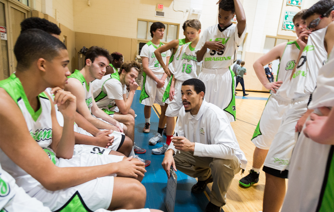 Boys basketball team huddles for inspiration