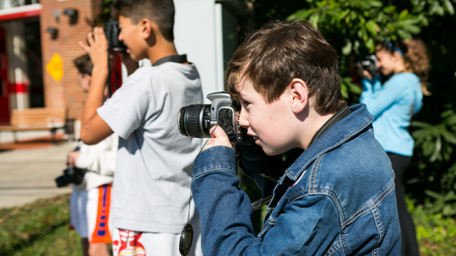 Photography class outside taking photos