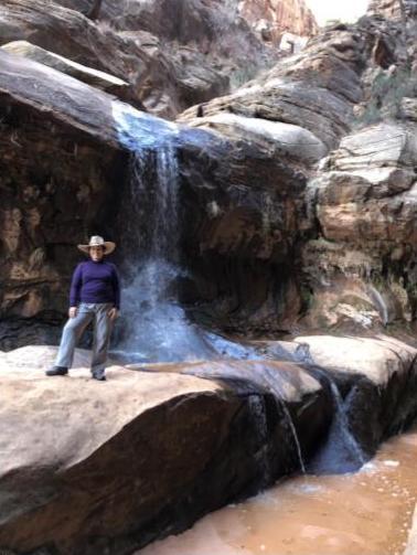 student at waterfall