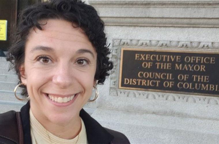 Melissa Wood takes selfie outside of DC Council offices